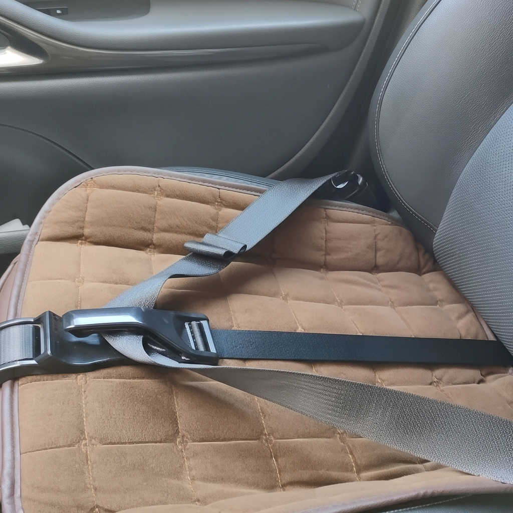 Close-up: lap belt held low through the MAXSSYPE Bump-Safe Seatbelt Adjuster