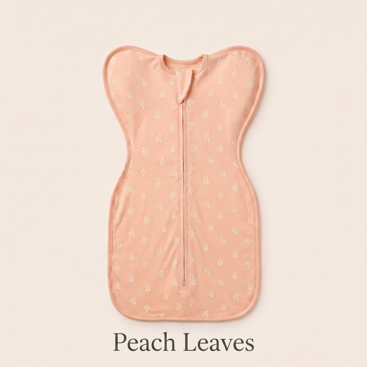 Peach Leaves DreamWrap swaddle with name label